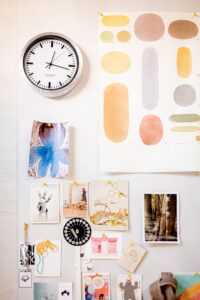 A wall with pictures and colour swatches